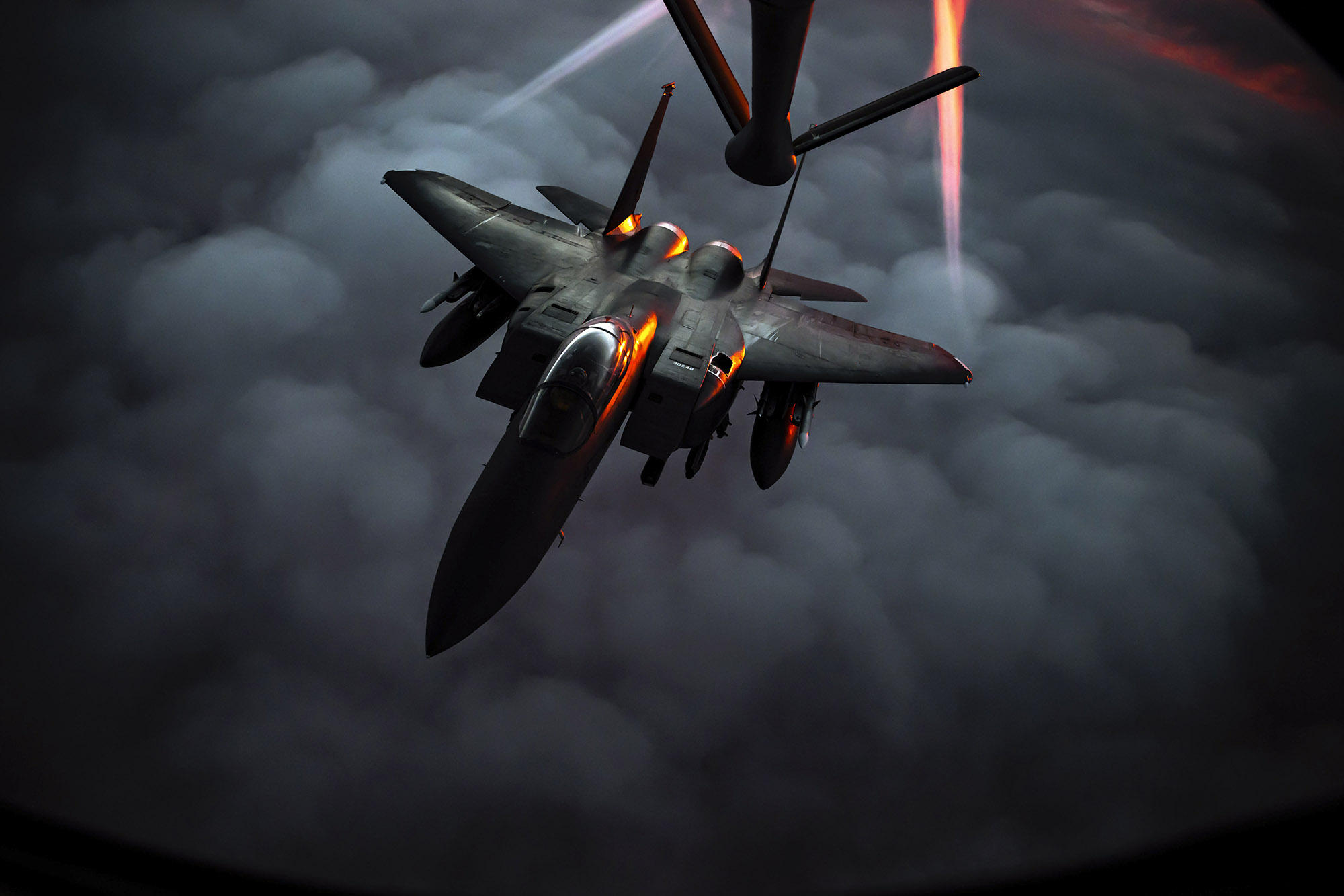 A U.S. Air Force F-15E Strike Eagle departs after receiving fuel from a U.S. Air Force KC-135 Stratotanker during an air refueling mission over Southwest Asia, Dec. 22, 2020.